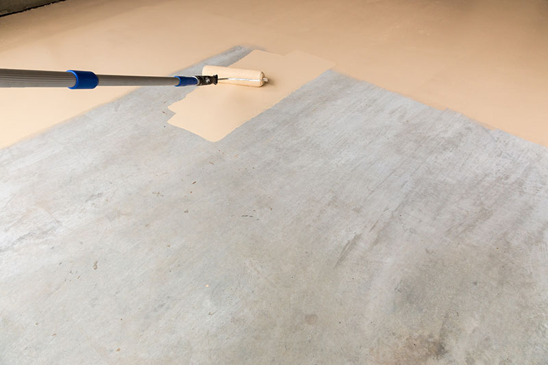 Worker Painting Floor of Garage.jpg